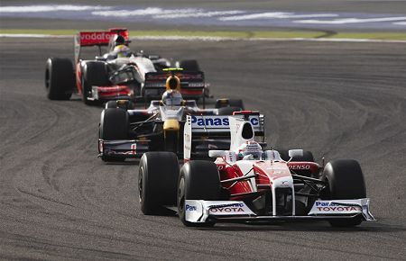 All aboard: Jarno Trulli leads the pack